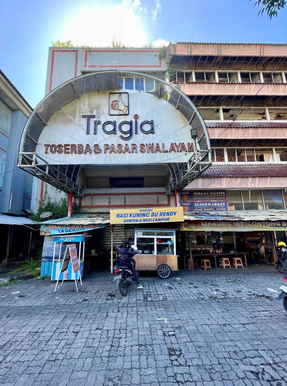Located at a former detention site for victims of the 1965 massacres, the “Tragia” supermarket has stood empty since 2007, with some locals considering it haunted.
