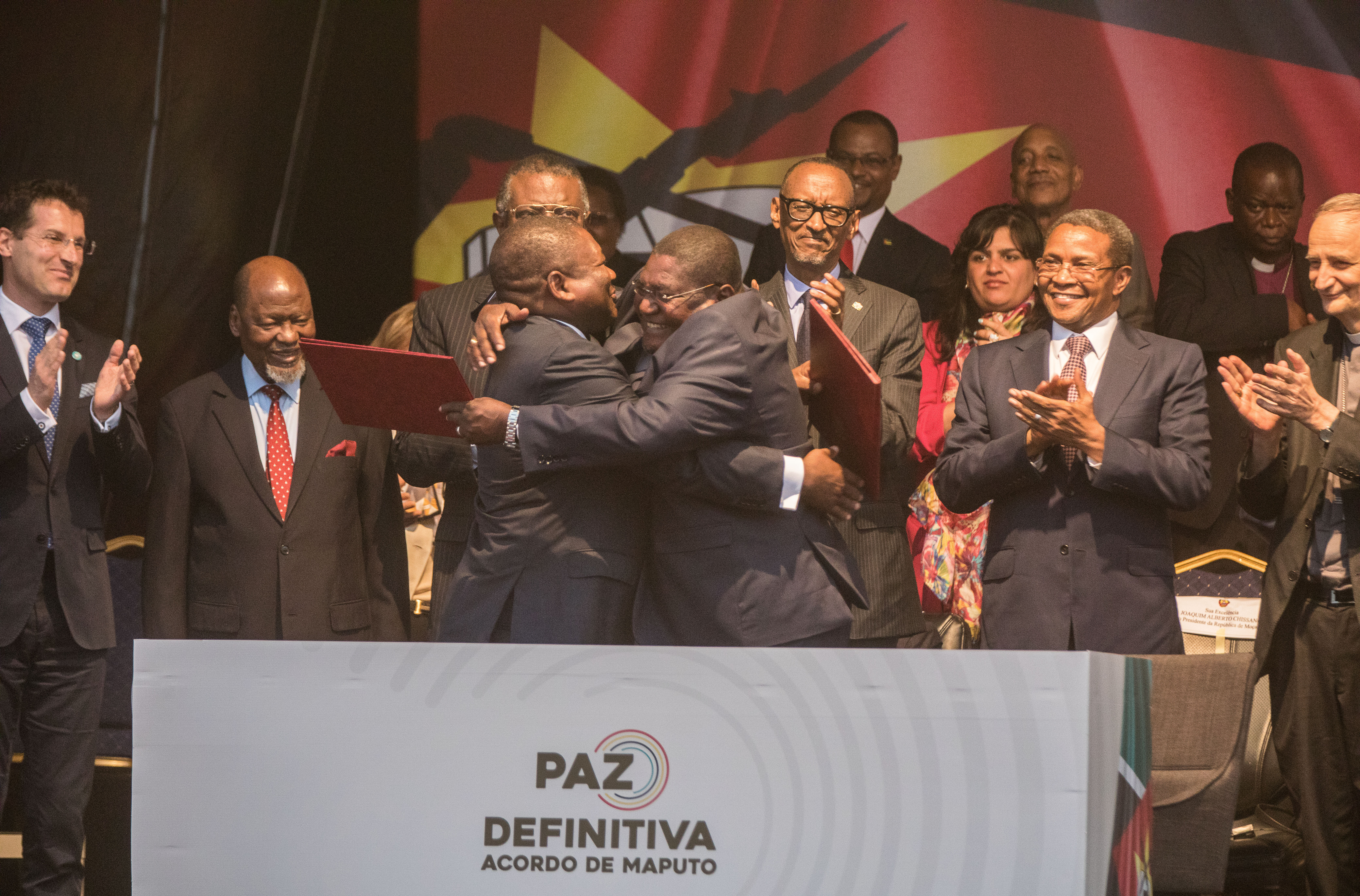 President Filipe Jacinto Nyusi, and the leader of Renamo, Ossufo Momade, embrace following the signing of the Maputo Accord for Peace and National Reconciliation in Maputo on 6 August 2019.