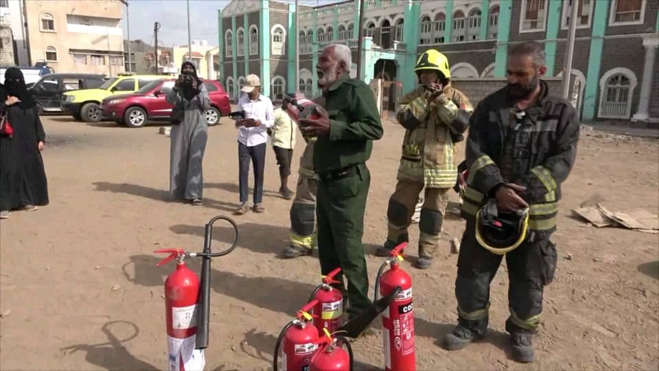 Volunteers and trainers at a training on basic firefighting techniques conducted by the civil defence Aden.