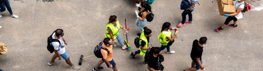 Volunteers clean the streets and distribute food near the site of the explosion, on the 3rd day after a huge unknown blast at the port of Beirut, Lebanon on August 7, 2020.