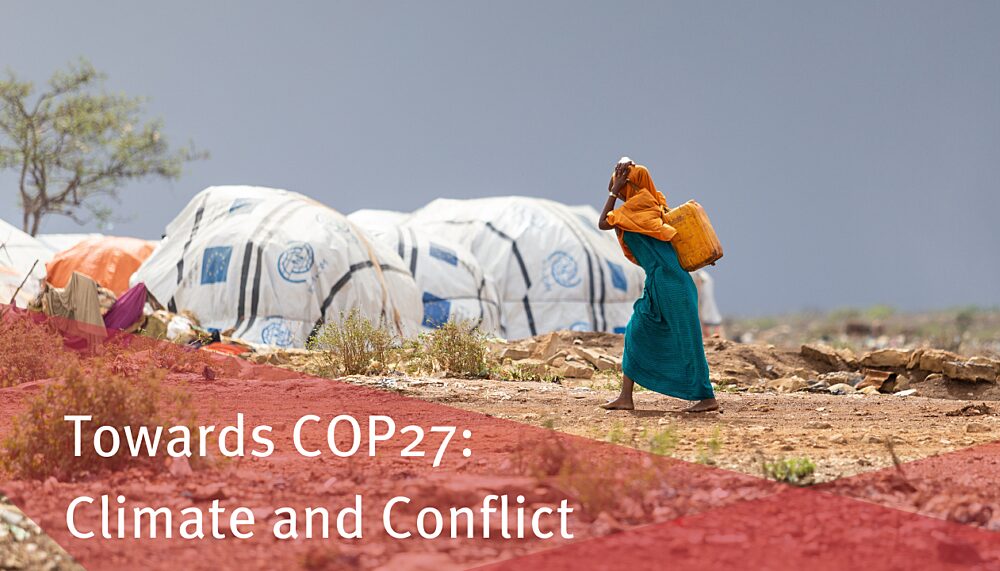 A Somali woman carrying water in a refugee camp