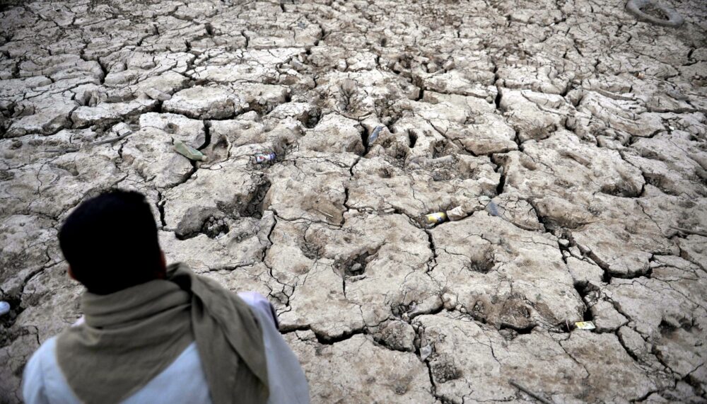 A Yemeni man sits at a drought-affected dam as water levels plummet on the outskirts of Sana'a, Yemen, 25 July 2012. According to international estimates, Yemen is one of the most water scarce countries in the world, where per capita availability of water is only 02 per cent of the world average.