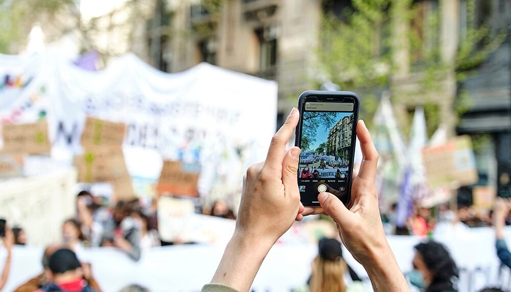 Taking pictures of protesters during the Global Climate Strike in Buenos Aires, Argentina