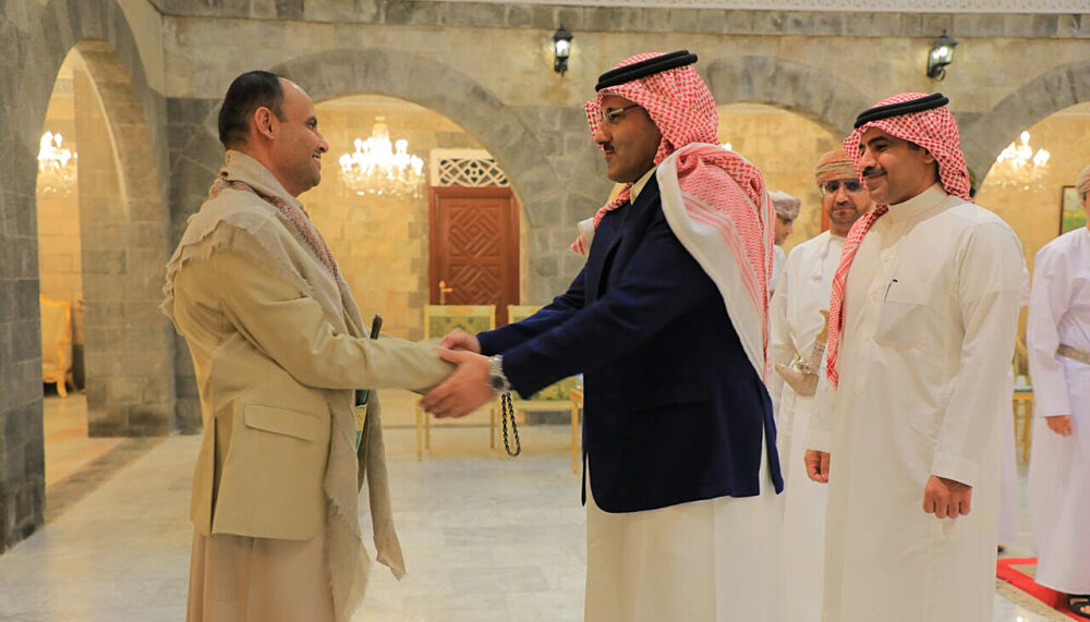 The head of the Houthi Supreme Political Council, Mahdi al-Mashat, shakes hands with Saudi ambassador to Yemen Mohammed Al-Jaber at the Republican Palace in Sanaa, Yemen April 9, 2023. |