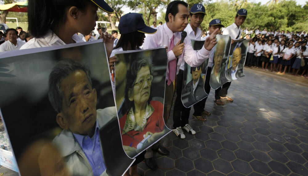 Court officer of the Khmer Rouge Tribunal speaks with students during a public forum in Phnom Penh.