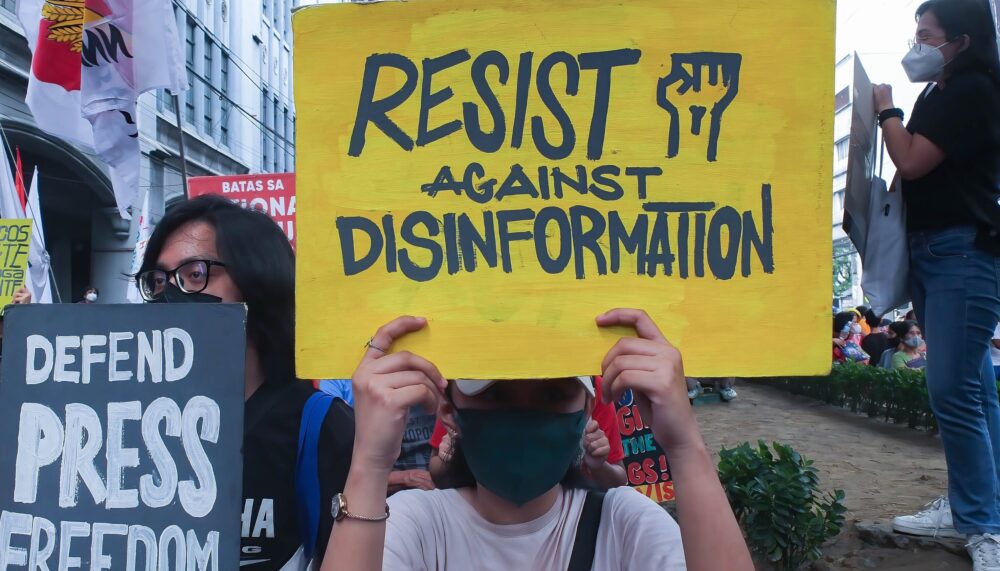 October 8, 2022, Manila, Philippines: Militant protesters hold placards with a message ''Defend Press Freedom'' and ''Resist against Disinformation'' during the demonstration. Militant groups staged a protest in Manila in connection with Ferdinand Marcos Jr. 100 days in power as Philippine President.