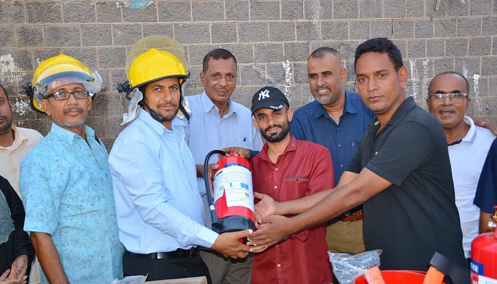 Members of the Community Safety Committee in Aden are handing over firefighting kits to selected neighborhoods in the Sirah district as part of their second initiative.