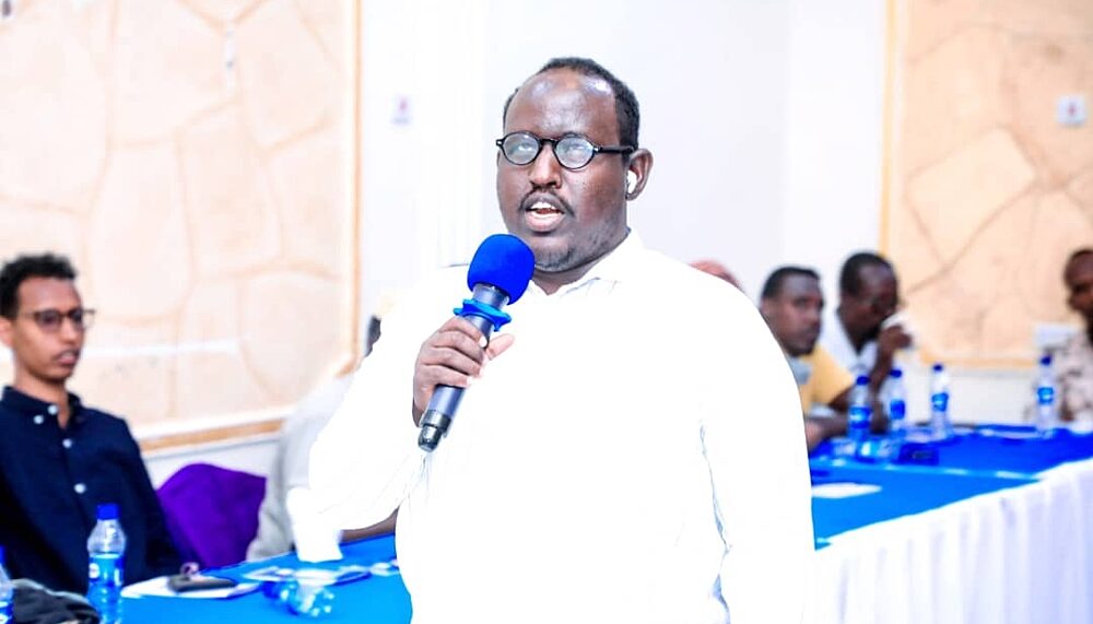 Ahmed Mohamed Jama speaks to community members about the human cost of conflict and the importance of choosing peace.