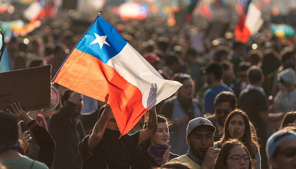 People protesting in the streets of Santiago de Chile.