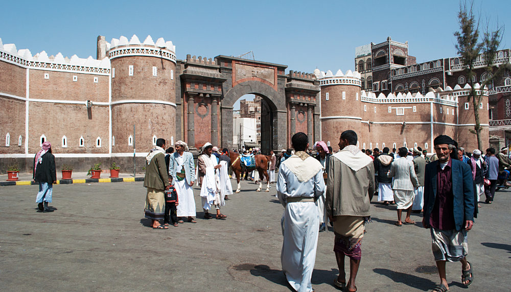 People in front of the Bab al-Yaman, main gate of the old fortified wall of Sana'a