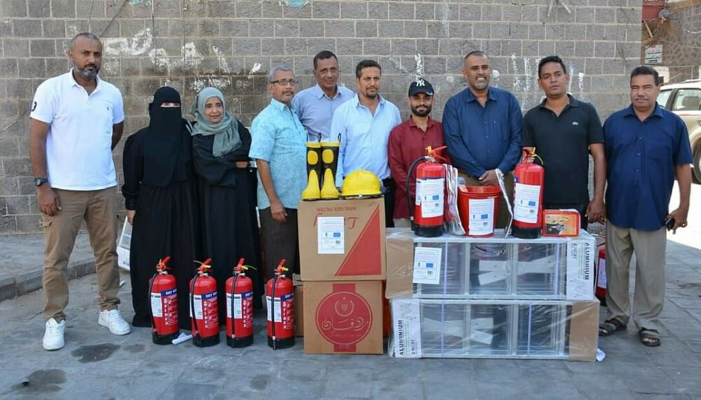 Members of the community safety committee in Crater handing over firefighting kits to selected neighbourhoods and mosques.